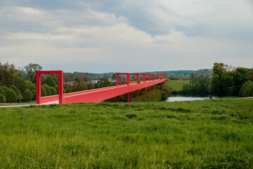 Paris, France 03-05-2021: a profile view of the red bridge major axis of cergy