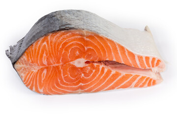 Piece of uncooked salmon on a white background close-up