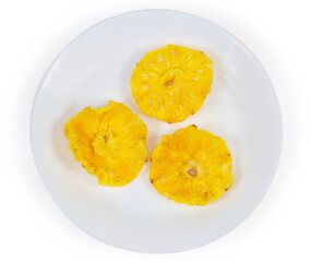 Top view of dried pineapples slices on white dish