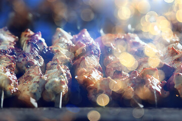 barbecue meat on coals, smoke smoked on iron skewers, fresh meat background
