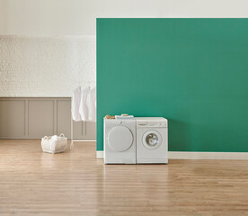 Washing machine and dryer room, white clean shirt, green wall and decorative background, linen...