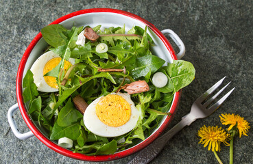 Dandelion egg salad with onions and cheese
