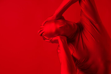 crazy screaming red man on a red background. figure in a leotard