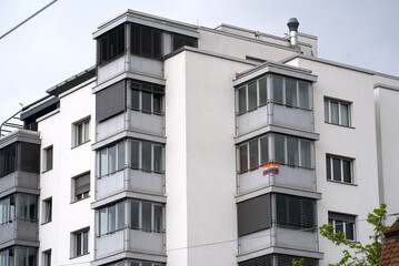 Apartment building at City of Zurich with rainbow flag on one balcony. Photo taken April 29th, 2021, Zurich, Switzerland.