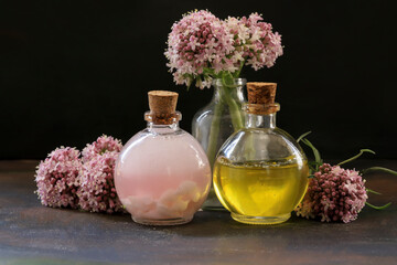 Obraz na płótnie Canvas valerian and oil in a bottle (Valeriana officinalis)