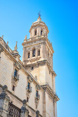 Fototapeta na wymiar Renaissance, baroque and neoclassical style Jaen cathedral tower with blue sky on a sunny day.Andalucia,Spain.