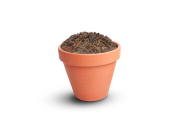 Brown soil in clay flower pot on white background.