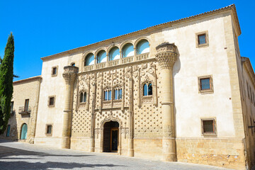 Jabalquinto Palace, current Antonio Machado headquarters of the International University of Andalusia in the city of Baeza, province of Jaén. Spain.In a sunny day with a blue Sky - obrazy, fototapety, plakaty