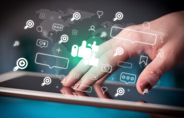 Close-up of a hand using tablet, social media concept