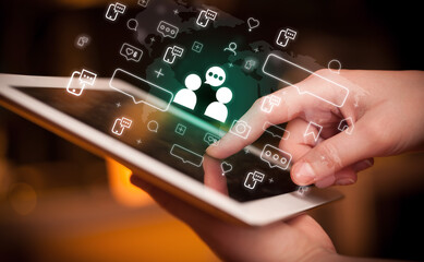 Close-up of a hand using tablet, social media concept