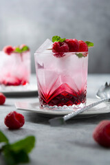 Summer fresh beverage cocktail with fresh raspberries and fresh mint.