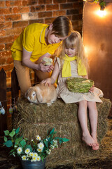 kids with a rabbit and chickens in Easter decor