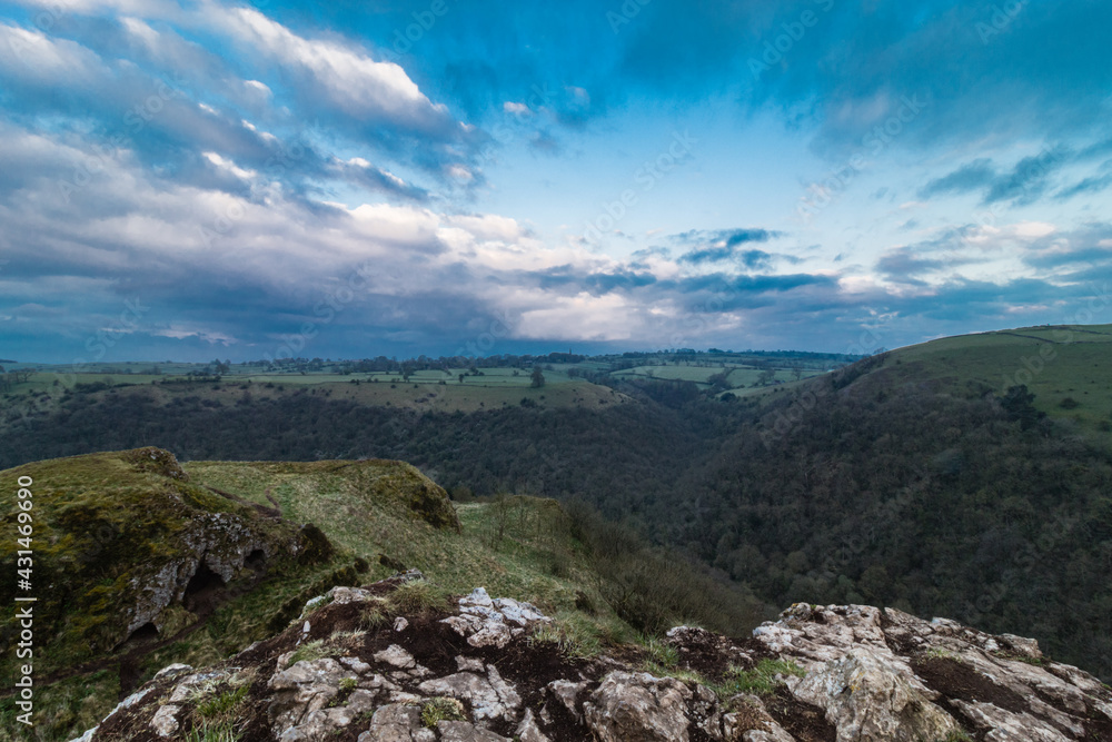 Poster climbing up in the mount on the morning in the peak district, thor cave