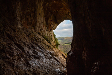 Climbing up in the mount on the morning in the Peak District, Thor Cave