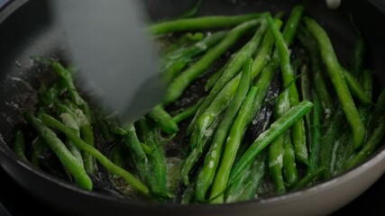 Green beans with spices ready for cooking in frying pan. Bio green beans. Cooking healthy home-made food.