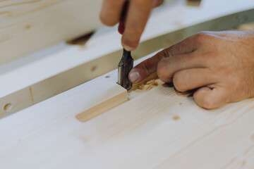 close up of a carpenter cutting wood
