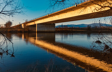Beautiful sunny winter evening view with reflections near Mettenufer, Danube, Bavaria, Germany