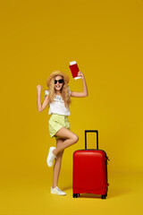 girl with red suitcase and passport with ticket going traveling