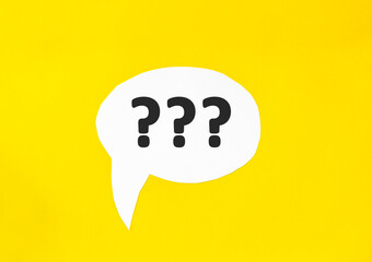 three question marks speech bubble isolated on the yellow background. Business concept