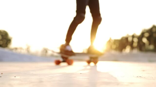 Unrecognized and blurred boy exercise surf skate , outdoor sport lifestyle of new normal ,In the moment Virus outbreak. Slow motion .