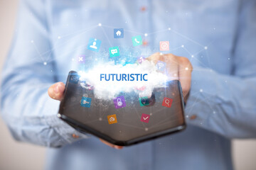 Businessman holding a foldable smartphone, technology concept