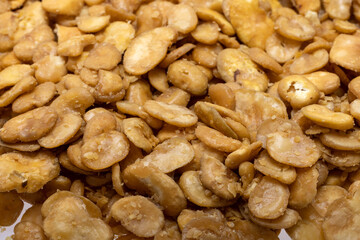 Roasted and salted fava beans for a healthy vegan and vegetarian diet snack. High in protein,...