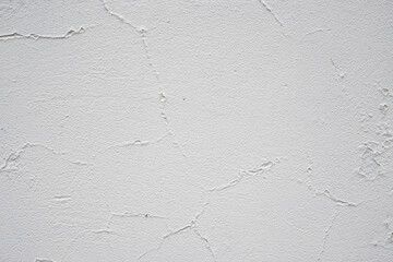 texture of old peeling white wall, cracks, vintage plaster