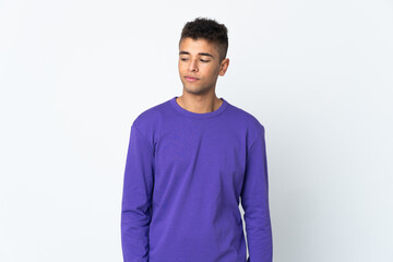 Young brazilian man isolated on white background having doubts while looking side