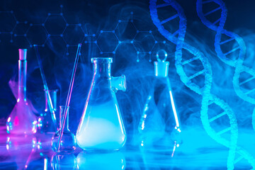 Blue scientific background with DNA and flasks. Genetic research. Genetic engineering. DNA genome....