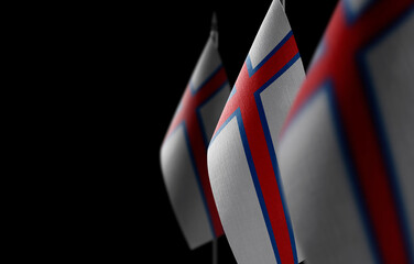 Small national flags of the Faroe Islands on a black background