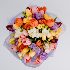 Bouquet with spring flowers, tulips, hyacinths, snowdrops, colorful flowers, axes and lily.