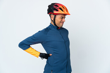 Young cyclist Brazilian man isolated on white background suffering from backache for having made an effort