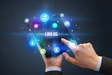 Businessman holding a foldable smartphone