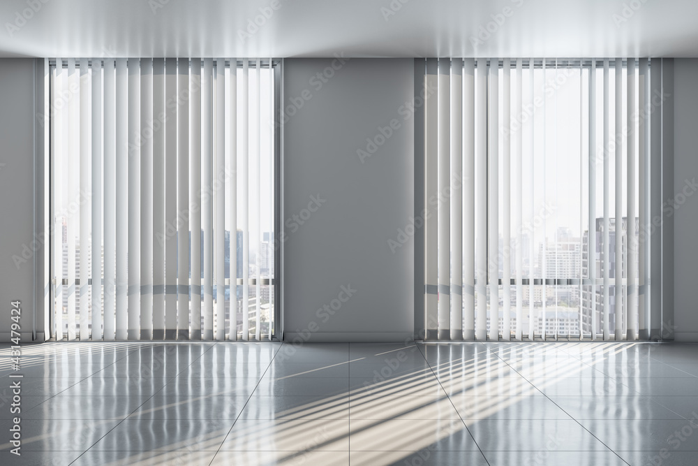 Poster sunny spacious empty room with ceramic tiles floor and city view from blinds on big windows