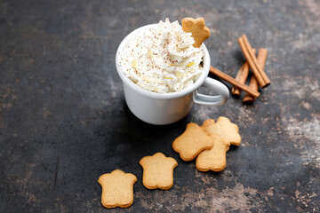 Hot chocolate with whipped cream and cinnamon. Spicy hot chocolate. A warming sweet dessert. Culinary photography.
