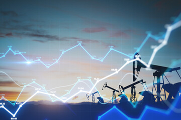 Fuel and oil industry quotes concept with digital financial chart diagram and oil pump jacks on a...