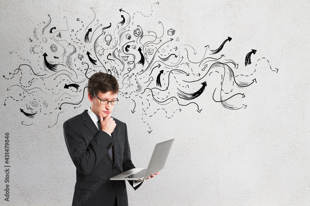 Poster making decision and choice concept with businessman with laptop on light wall backdrop with black dr