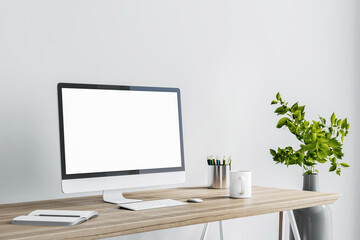 Blank white computer monitor as a part of stylish home work place with modern grey vase on floor at light wall background. 3D rendering, mockup