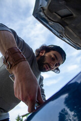 person fixing a car