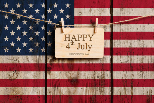 Happy 4th of July Greeting. Congratulations on Independence Day against the background of the old US flag.