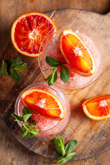 Homemade Italian Granita Dessert with blood orange, elderflower, rose wine  in serving glasses.