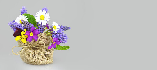 Mothers Day card with spring flowers on gray background with copy space