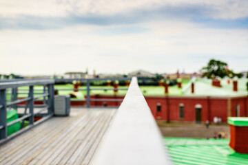 Summer in the city, a walking terrace with panoramic views of the city. Close up view from the handrail on the sidewalk level