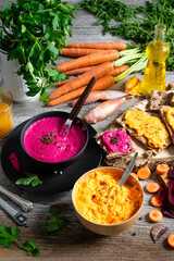 fresh vegan beetroot bowl with carrots and crispbread