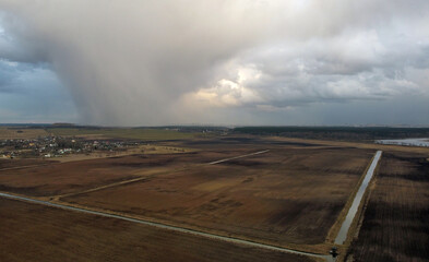 Top view of rain clouds at sunset