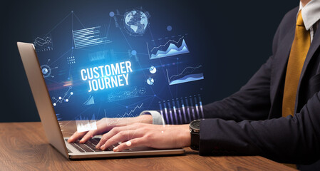 Businessman working on laptop, business concept