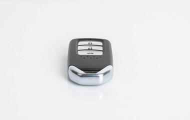 New car wave key with remote control on white background, isolated.