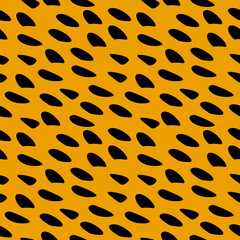 Spotted fur. Seamless yellow stained ornament.