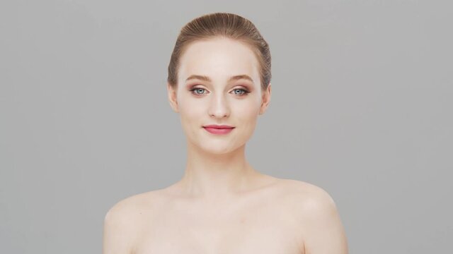 Studio portrait of young, beautiful and natural woman. Face lifting, cosmetics and make-up concept.
