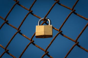 Blank love lock on the fences of the Golden Gate Bridge with a blue sky background, San Francisco, California, United States of America aka USA